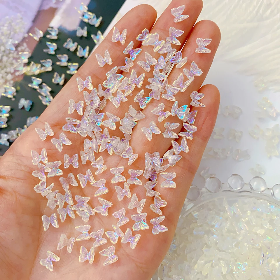 100ks farebné Aurora Butterfly nechtové dekorácie 6 mm živice Mini 3D Butterfly nechtové kúzla Ab /ružové roztomilé manikúra Butterfly n*