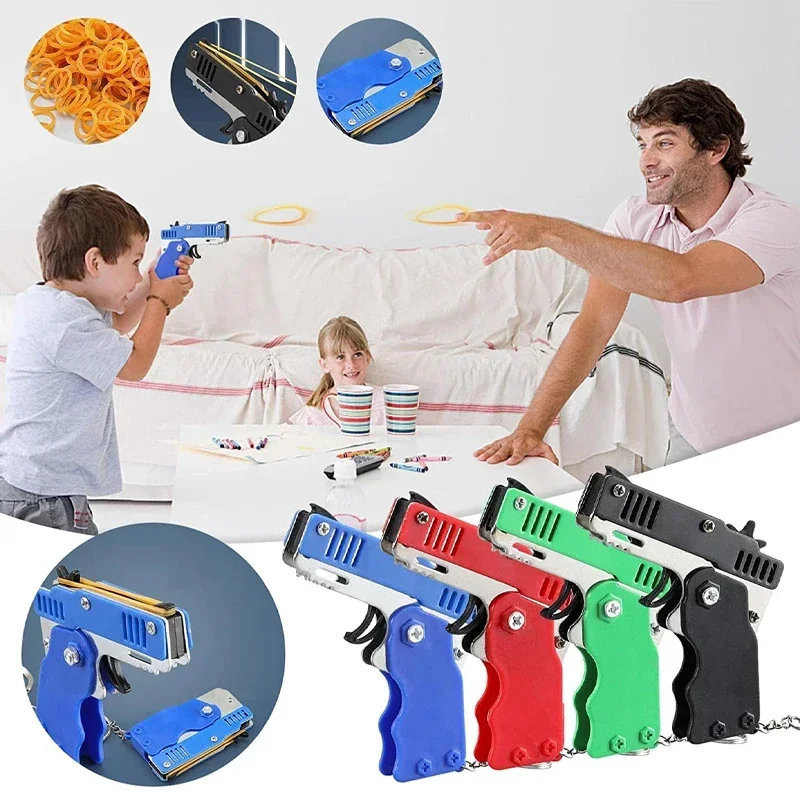 1ks keychain pištoľ 60 gumové kapely gumová kapela pištoľ natáčanie pištoľ zliatiny Kid vonku párty kovové pištoľ darček pre priateľstvo darček vtipné