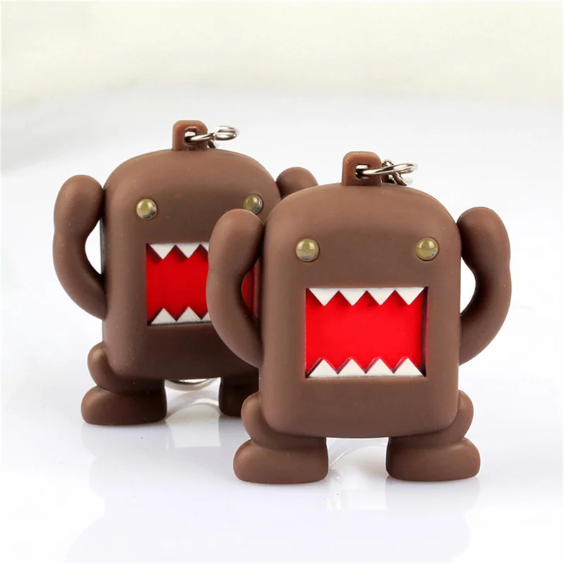 1pcs Ultra Bright LED roztomilý roztomilý mini domo Kun Action figure hračky LED baterky Kľúčenky so zvukovými kľúčovými darčekmi