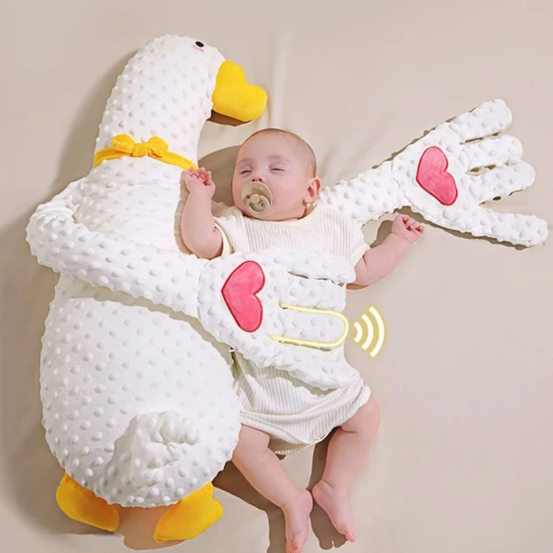 Automatická veľká biela husací výfukový vankúš upokojuje upokojuje jej palmové dieťa spí sama o sebe