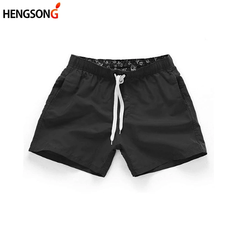 Hengsong Summer New Man Slires Stredný pás Beach Krátke nohavice Rovná štrbina surfovania Štyri farby S-2XL Sligáty Men