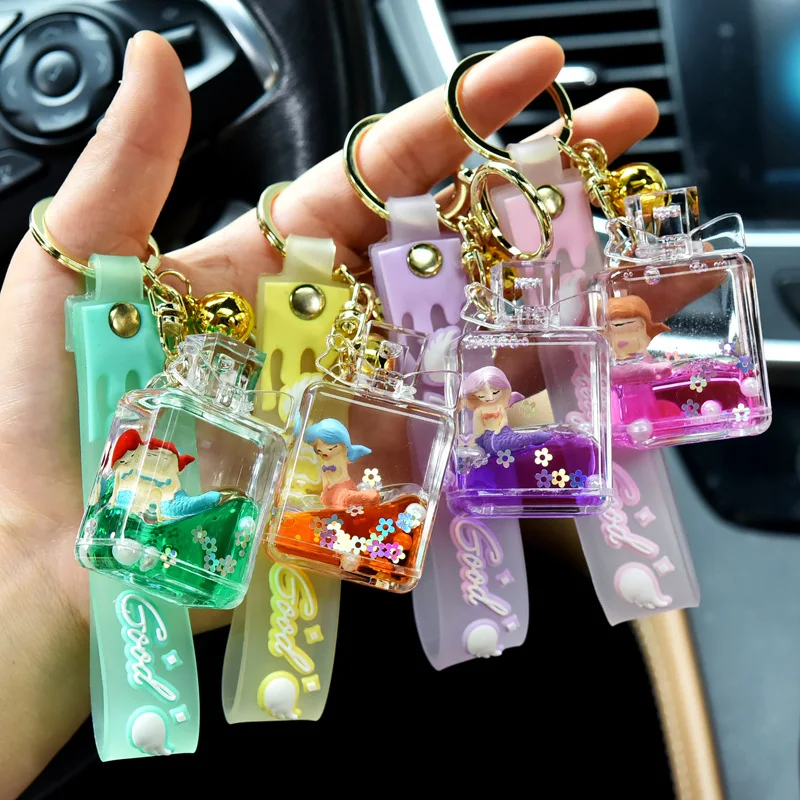 Kreatívna ropná tekutina Quicksand Parfum fľaša plávajúce bábiky Keychain akrylová kabelka Prívesok Veľkoobchod