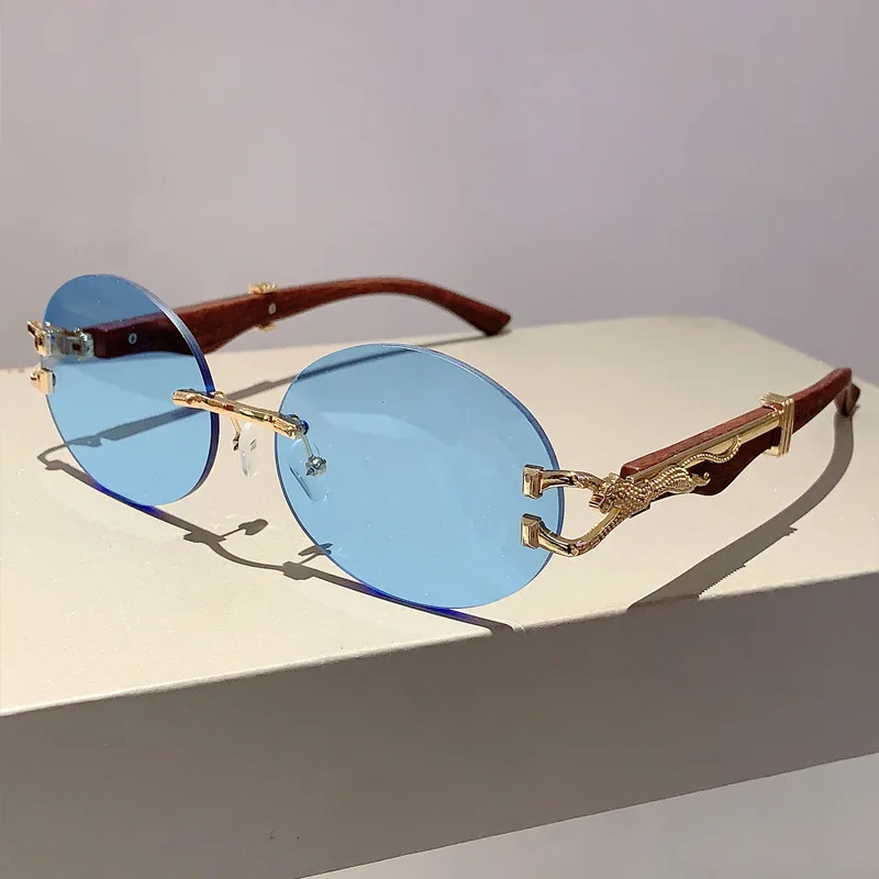 Luxusný dizajnér značky Vintage Rimless Oval Slnečné okuliare Ženy pre mužov Slnečné okuliare Trendy Punk Populárne kovové leopardové okuliare