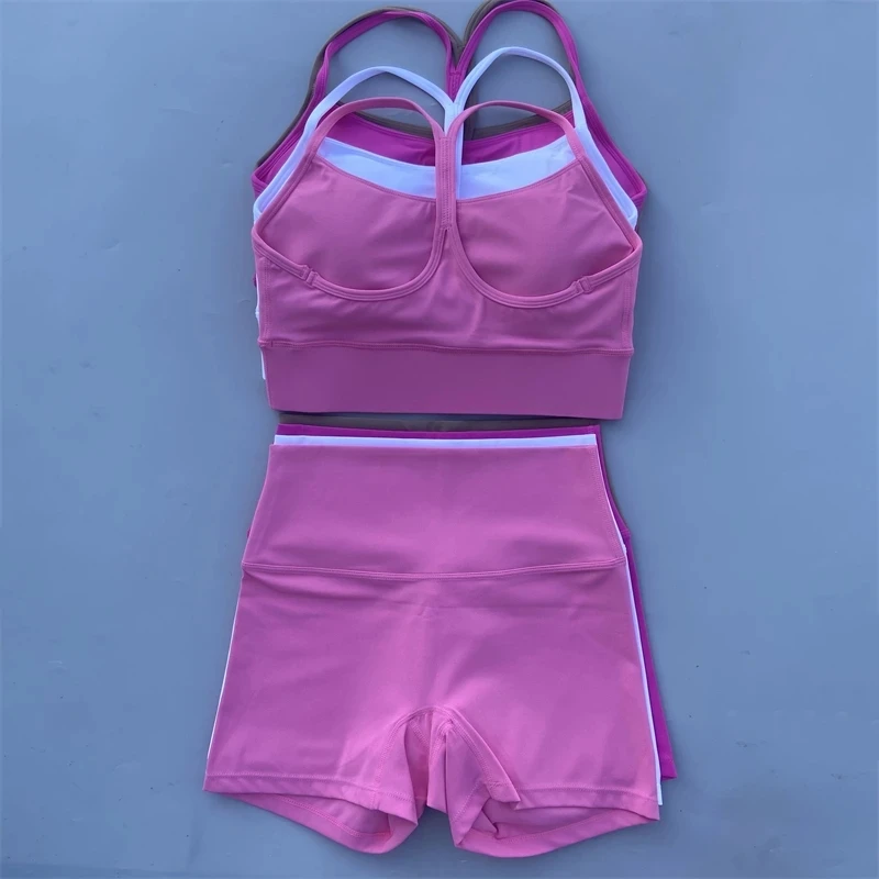 Masívna farebná telocvičňa Jóga Sada Krátke nohavice 2pc +krížový tvar Sport Sport podprsenka Tracksuit Atletic Women Suit Komplexný tréning jogging