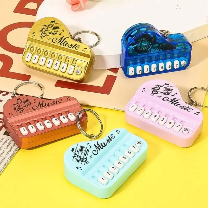 Mini elektronická klávesnica Keychain Prenosný hudobný nástroj Piano Keychain Hray Elektronická klávesnica zavesenie závesných hračiek
