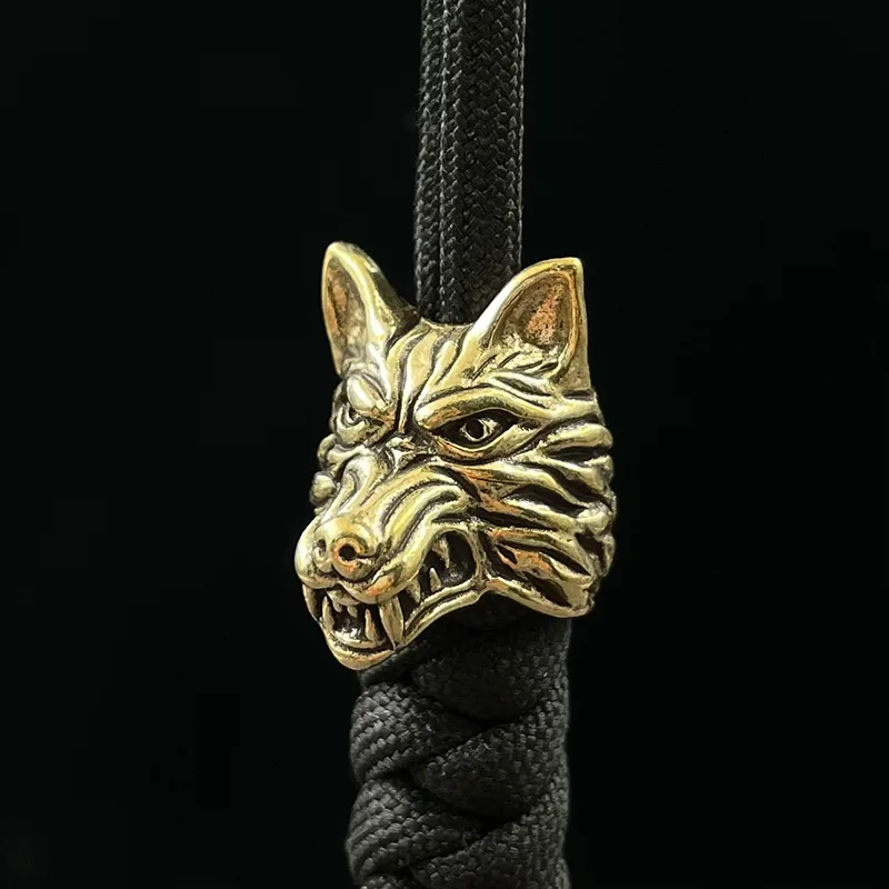 Mosadz Wolf Head Warrior Nôž korálky prívesky šperky vonkajší dáždnik ručne vyrábaný ručným šnúrkou navijak