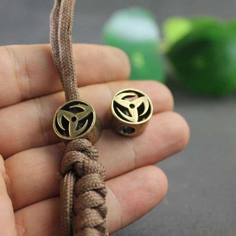 Mosadzný veterný a ohnivý nôž korálky EDC Outdoor DIY Paracord Doplnky tkané náramkové kúzlo Kúzlo