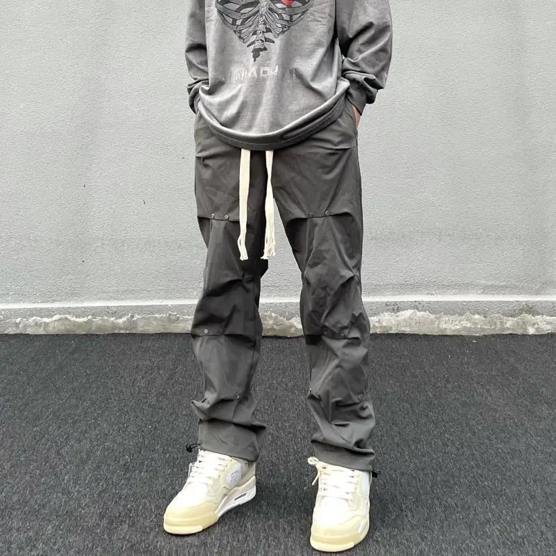 Módne bežci Men nákladné nohavice High Street Unikátny skladaný dizajn streetwear hip hop hop harajuku pánske nohavice rovné široké nohy