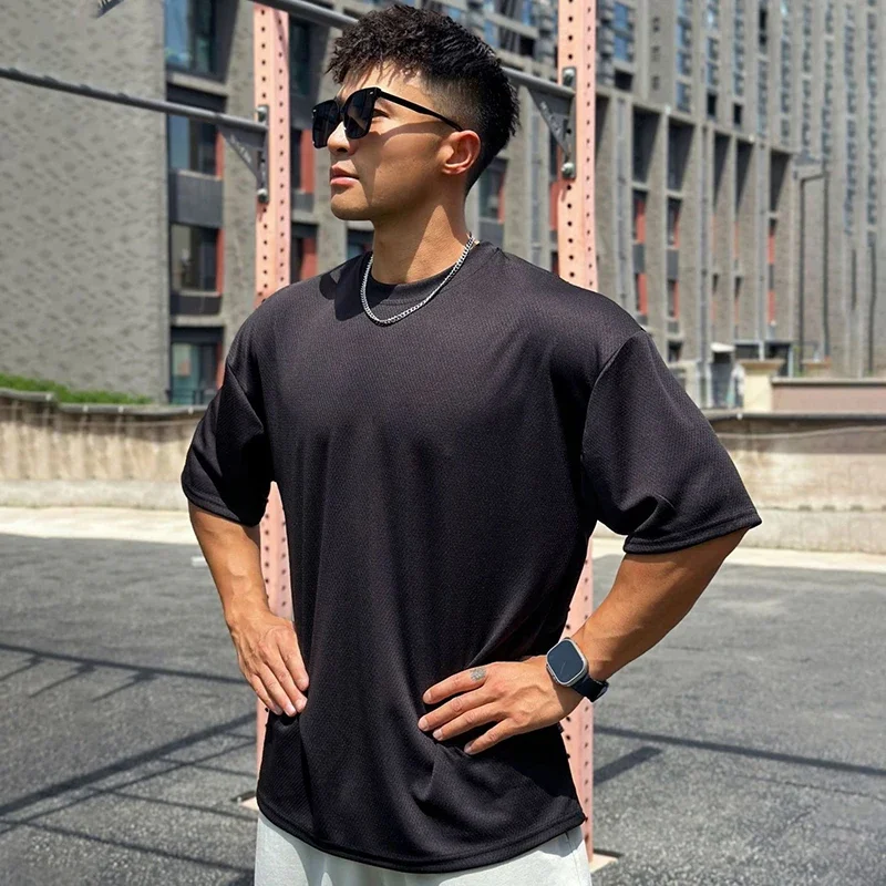 Nadmerná voľná pánska športová športová tričká telocvičňa Fitness Training Training Clothing Summer Mesh krátke rukávy rýchle suché tričko