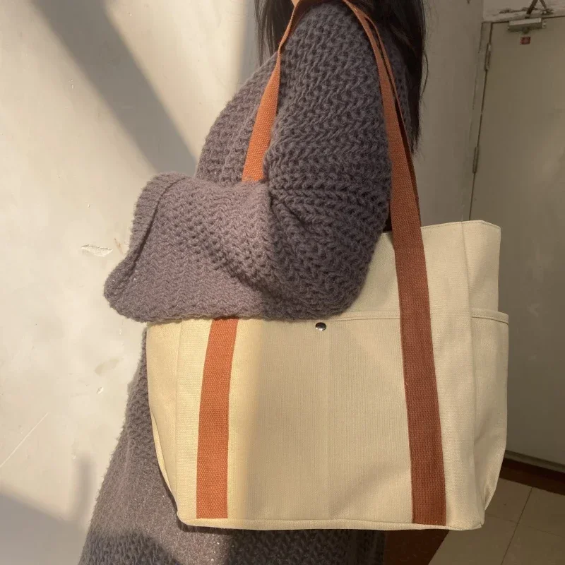 Niche dizajn trend taška na rameno módne všestranné minimalistické dámske dámske tašky unisex veľká kapacita prenosné plátno kabelka