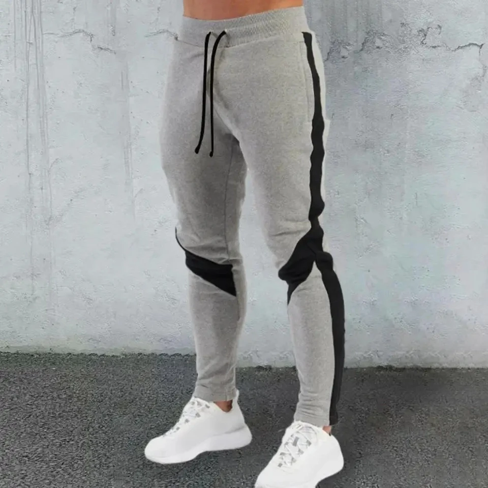 Nové pánske jesenné a zimné príležitostné farby zodpovedajúce nohavicami Kórejské oblečenie Fashion Sports and Fitness Pants Havárska telocvičňa