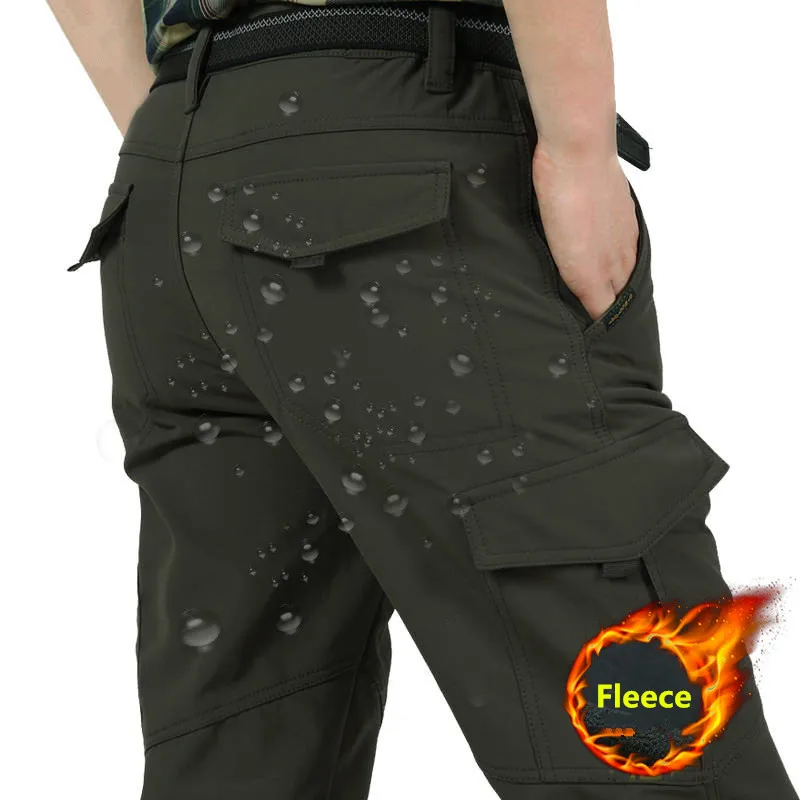 Noví 2023 mužov Zima hrubý teplý nákladný nohavice Príležitostné fleecové vrecká Dlhé nohavice Módne voľné vrecká Jogeer Pracovník Mužské nohavice 4xl