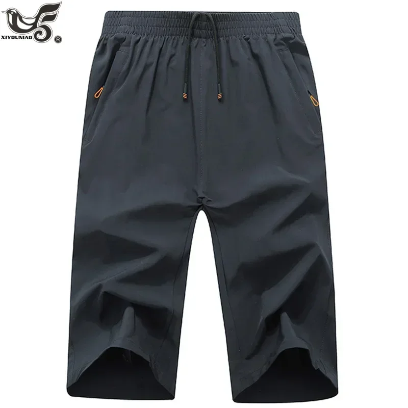 Plus veľkosť 8xl 9xl letná telocvičňa joggers športové šortky muži Rýchle suché 3/4 Capri Pants Zipper vreckej