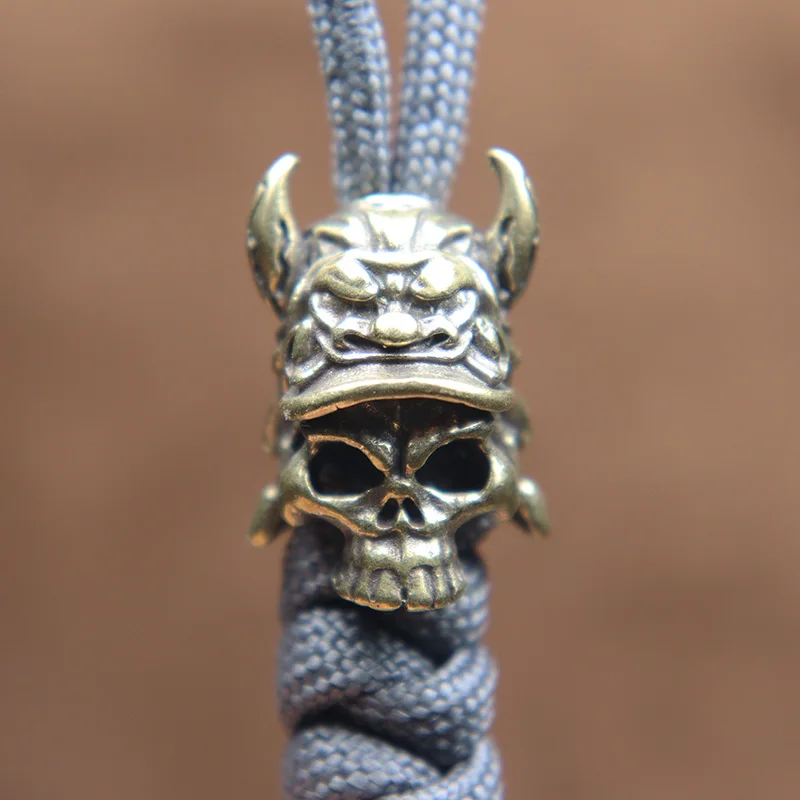 Prasknutá hranolka Horn Tiger Helma lebka lebka Warrior nôž guľôčky mosadz DIY Paracord tkaná šnúrka Keychain prívesok šperky