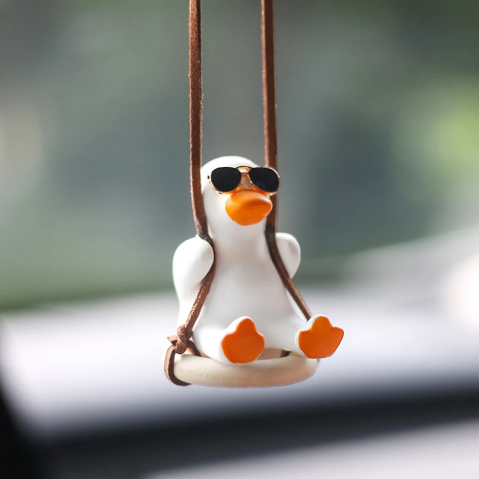 Sadra chladná biela swing kačica so slnečnými okuliarmi automaty