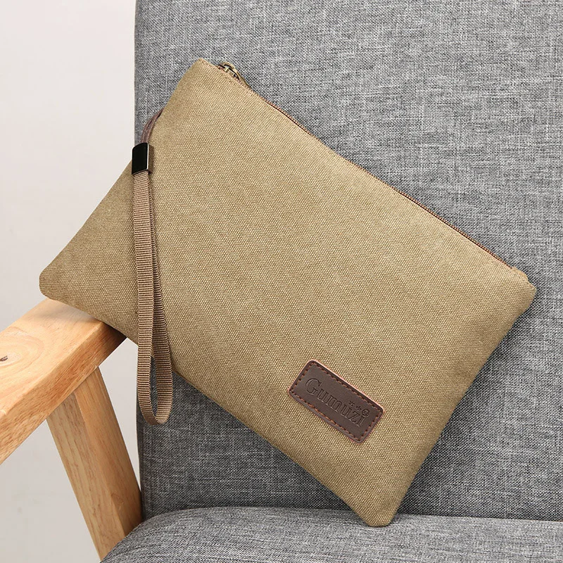 Vysoko kvalitné plátno Men Clutch Bag 2023 Nové neformálne nákupné obálky Denné spojky Claces Pevná farba cestovná úložisko iPad peňaženka vrecko